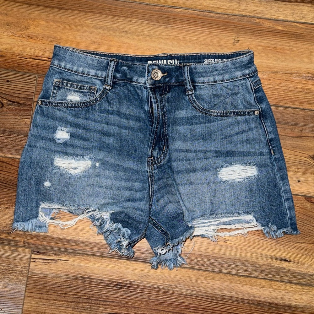 Ripped distressed blue jean shorts